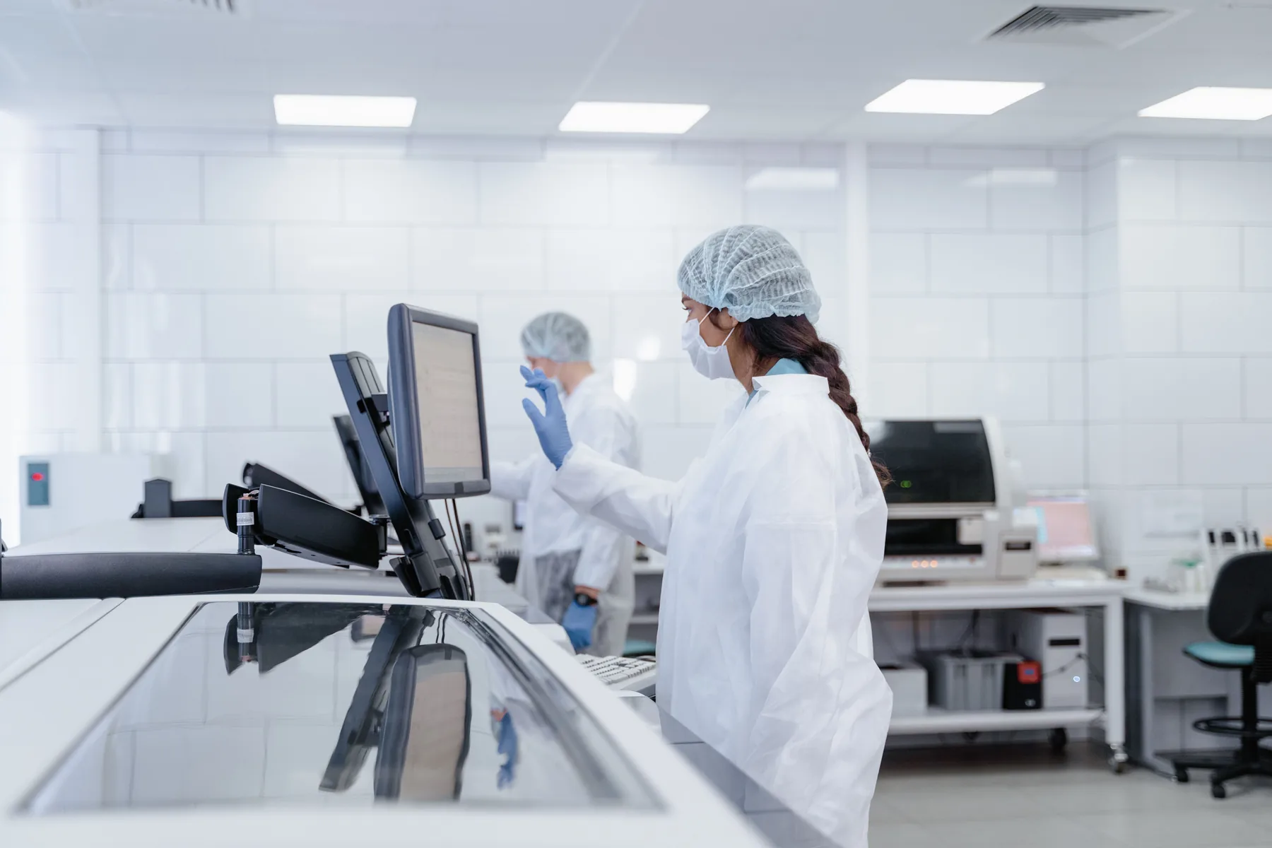 Life-science professionals working with connected operational systems